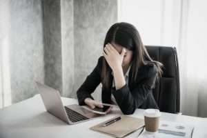 women with stress hands head while thinking with new project workplace 24797 74 300x200 -